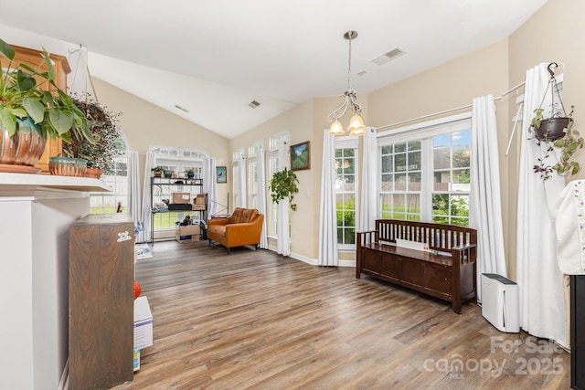 5128 Balsam Bark Ln, Fort Mill, SC 29708 - living area featuring wood finished floors, vaulted ceiling, and a chandelier