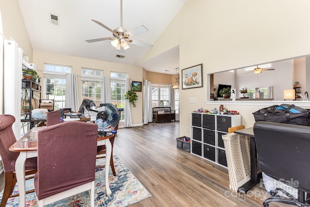 5128 Balsam Bark Ln, Fort Mill, SC 29708 - dining room with a ceiling fan, wood finished floors, and high vaulted ceiling