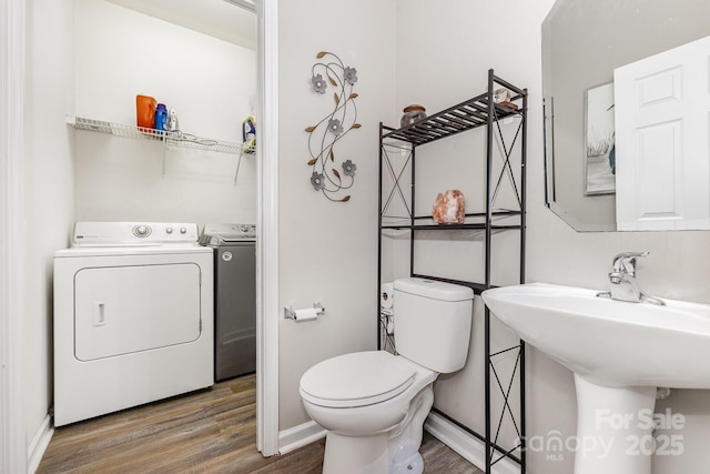5128 Balsam Bark Ln, Fort Mill, SC 29708 - half bath with wood finished floors and washer and clothes dryer