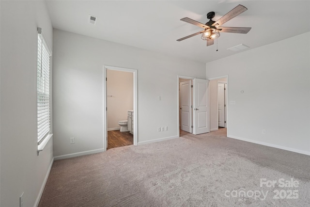 5037 Patton Dr, Gastonia, NC 28056 - unfurnished bedroom featuring carpet flooring, ensuite bathroom, and a ceiling fan