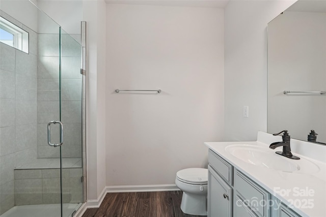 5037 Patton Dr, Gastonia, NC 28056 - bathroom featuring vanity, wood finished floors, and a shower stall