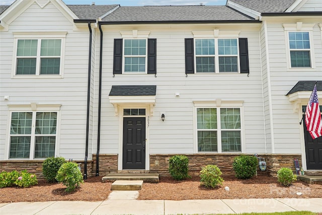 5037 Patton Dr, Gastonia, NC 28056 - view of property featuring stone siding and a shingled roof