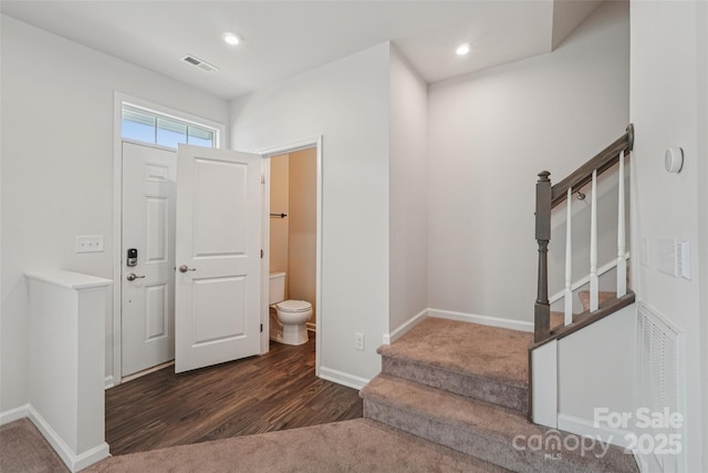 5037 Patton Dr, Gastonia, NC 28056 - entrance foyer featuring wood finished floors, stairway, and recessed lighting