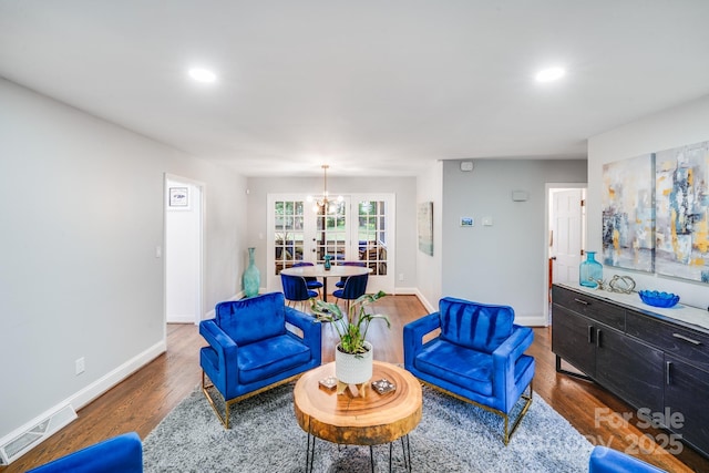 3920 Tilley Morris Rd, Matthews, NC 28105 - living room with wood finished floors, recessed lighting, and french doors