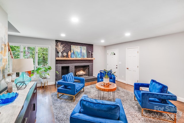 3920 Tilley Morris Rd, Matthews, NC 28105 - living room with recessed lighting, a fireplace, and wood finished floors