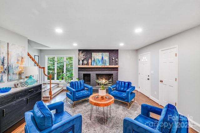 3920 Tilley Morris Rd, Matthews, NC 28105 - living room with stairway, wood finished floors, recessed lighting, and a fireplace