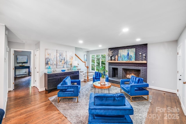3920 Tilley Morris Rd, Matthews, NC 28105 - living area featuring stairway, wood finished floors, recessed lighting, and a fireplace