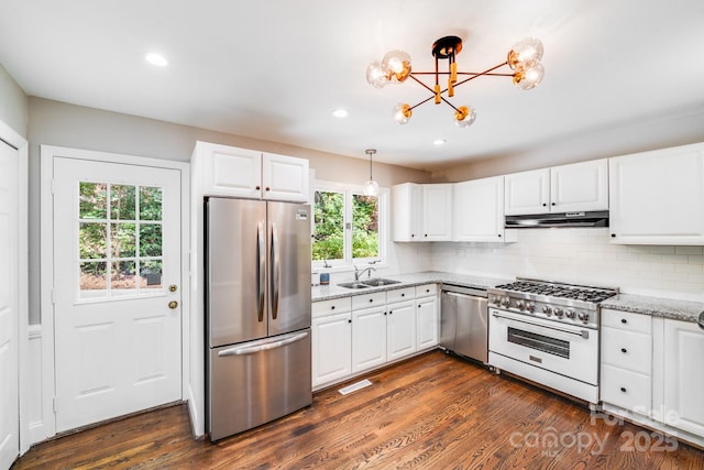 3920 Tilley Morris Rd, Matthews, NC 28105 - kitchen featuring stainless steel appliances, under cabinet range hood, a chandelier, light stone countertops, and white cabinetry