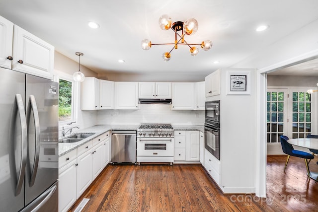 3920 Tilley Morris Rd, Matthews, NC 28105 - kitchen with black appliances, a chandelier, under cabinet range hood, tasteful backsplash, and recessed lighting