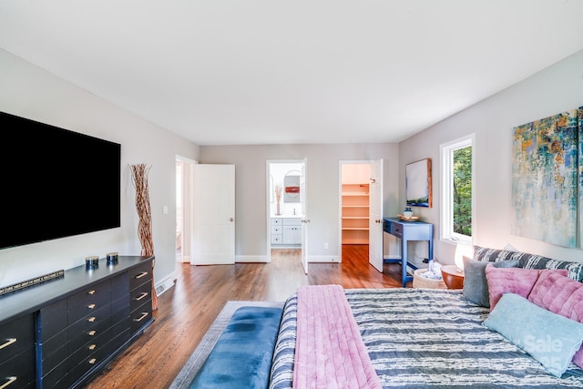 3920 Tilley Morris Rd, Matthews, NC 28105 - bedroom featuring wood finished floors and a spacious closet