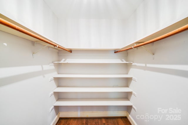 3920 Tilley Morris Rd, Matthews, NC 28105 - walk in closet featuring wood finished floors