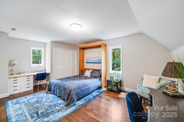 3920 Tilley Morris Rd, Matthews, NC 28105 - bedroom with an office area, wood finished floors, vaulted ceiling, and a closet