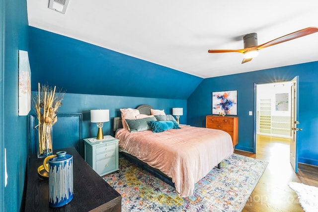 3920 Tilley Morris Rd, Matthews, NC 28105 - bedroom with wood finished floors, vaulted ceiling, and ceiling fan