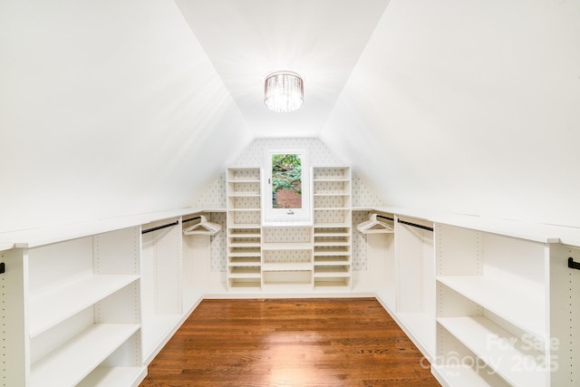 3920 Tilley Morris Rd, Matthews, NC 28105 - spacious closet with wood finished floors, vaulted ceiling, and a chandelier