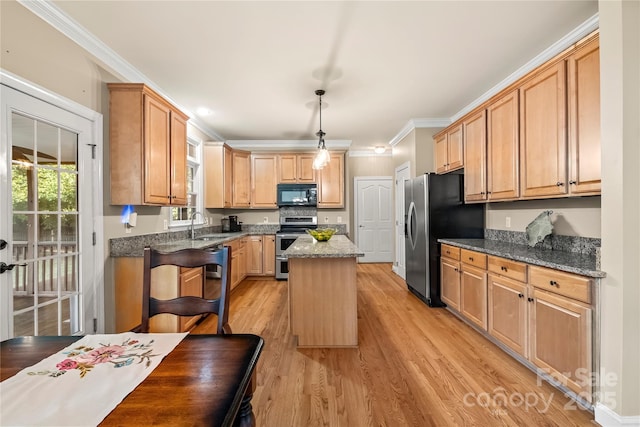 6123 Abergele Ln, Matthews, NC 28104 - kitchen with stainless steel appliances, ornamental molding, a center island, light wood-type flooring, and dark stone countertops
