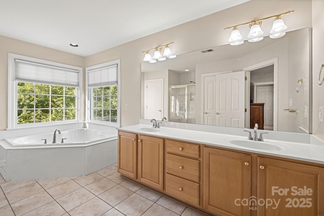 6123 Abergele Ln, Matthews, NC 28104 - full bath featuring a stall shower, double vanity, a garden tub, and tile patterned floors