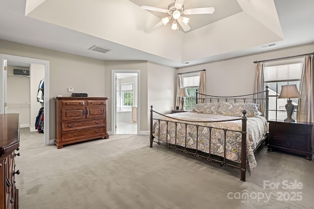 6123 Abergele Ln, Matthews, NC 28104 - carpeted bedroom with a walk in closet, a closet, ceiling fan, ensuite bathroom, and a wall unit AC
