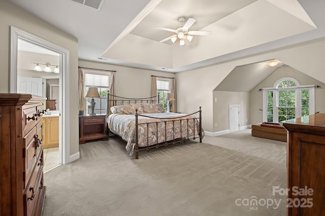 6123 Abergele Ln, Matthews, NC 28104 - bedroom featuring light colored carpet, a raised ceiling, ceiling fan, and connected bathroom
