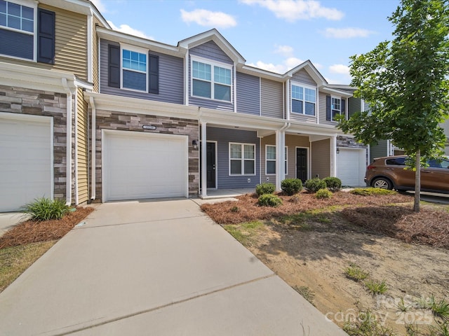 15239 Wrights Crossing Dr, Charlotte, NC 28278 - view of front of property featuring stone siding, a garage, a porch, and driveway