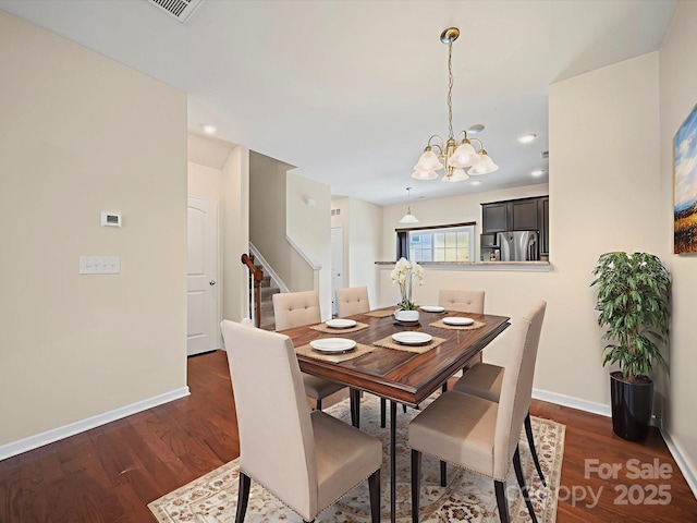 15239 Wrights Crossing Dr, Charlotte, NC 28278 - dining area with stairs, dark wood-style flooring, a chandelier, and recessed lighting