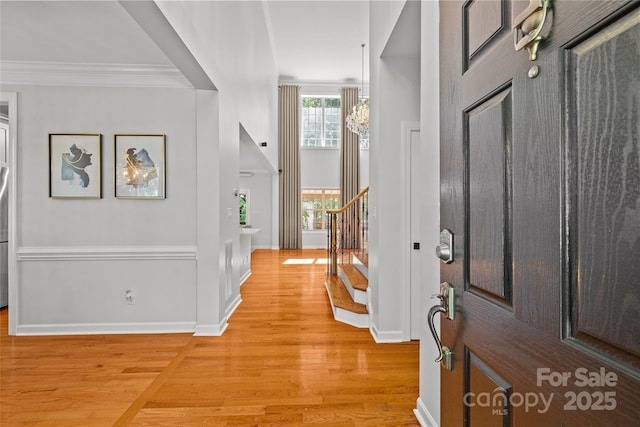 12336 Tantallon Ct, Pineville, NC 28134 - foyer entrance with light wood-type flooring, stairs, and crown molding