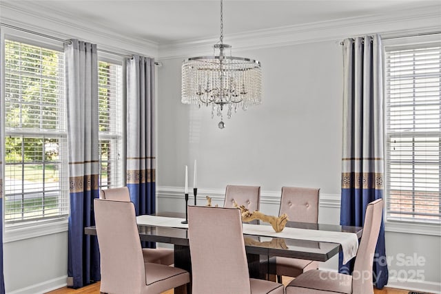 12336 Tantallon Ct, Pineville, NC 28134 - dining room with a chandelier, crown molding, and wood finished floors