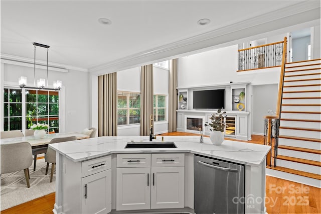 12336 Tantallon Ct, Pineville, NC 28134 - kitchen with dishwasher, open floor plan, light wood-style floors, ornamental molding, and a chandelier