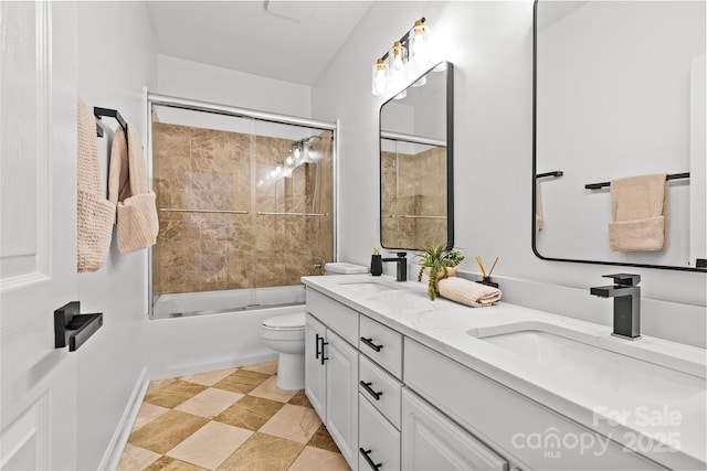 12336 Tantallon Ct, Pineville, NC 28134 - bathroom featuring double vanity and combined bath / shower with glass door