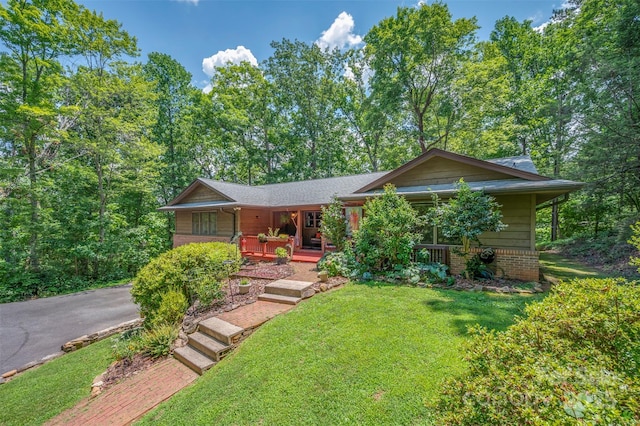 467 Winners Cir, Tryon, NC 28782 - view of front of home with covered porch and a front lawn