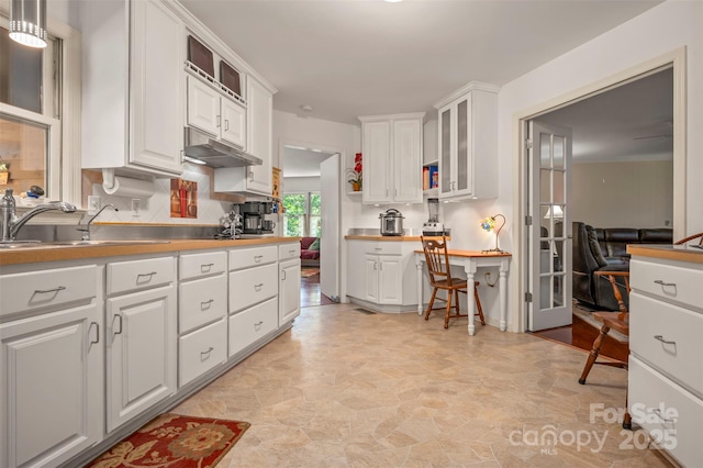 467 Winners Cir, Tryon, NC 28782 - kitchen with white cabinetry, glass insert cabinets, and light countertops