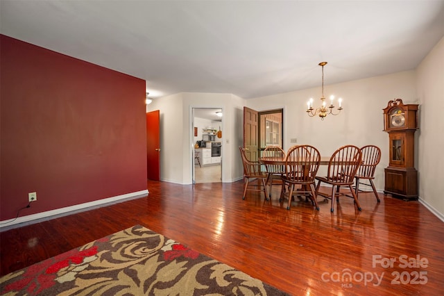 467 Winners Cir, Tryon, NC 28782 - dining room featuring wood finished floors and a chandelier