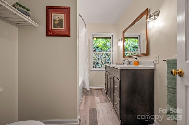 467 Winners Cir, Tryon, NC 28782 - bathroom featuring vanity, wood finished floors, and shower / tub combo