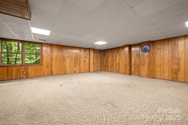 467 Winners Cir, Tryon, NC 28782 - empty room with carpet flooring, a drop ceiling, and wooden walls