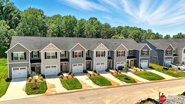 1525 39th Avenue Loop NE Unit 4, Hickory, NC 28601 - townhome / multi-family property featuring driveway, board and batten siding, a garage, and a residential view