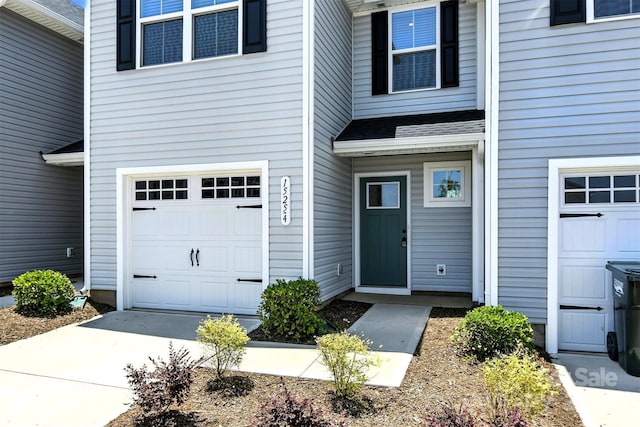 1525 39th Avenue Loop NE Unit 4, Hickory, NC 28601 - view of exterior entry with roof with shingles and driveway