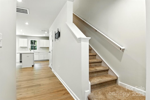 1525 39th Avenue Loop NE Unit 4, Hickory, NC 28601 - staircase featuring wood finished floors and recessed lighting