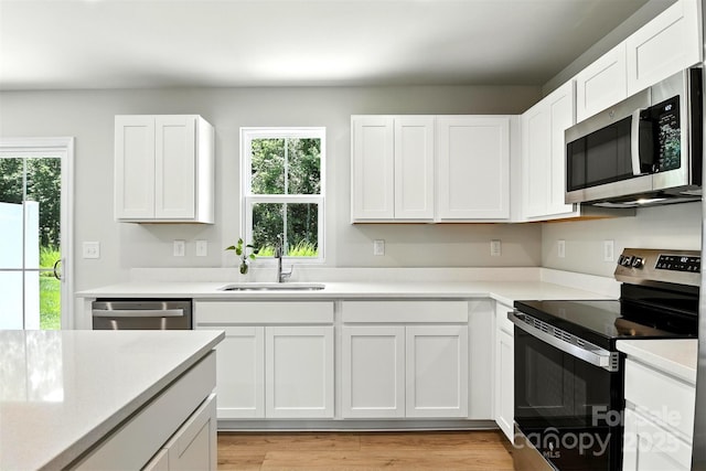 1525 39th Avenue Loop NE Unit 4, Hickory, NC 28601 - kitchen with appliances with stainless steel finishes, light countertops, and white cabinets