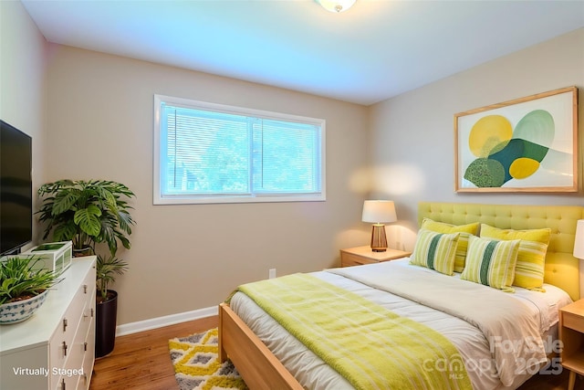 2519 Abelwood Rd, Charlotte, NC 28216 - bedroom with wood finished floors and baseboards