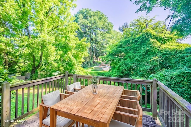 2519 Abelwood Rd, Charlotte, NC 28216 - wooden deck featuring outdoor dining space and view of wooded area