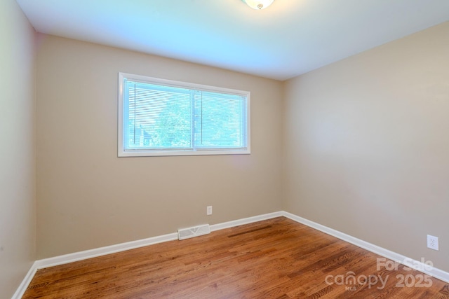 2519 Abelwood Rd, Charlotte, NC 28216 - unfurnished room featuring wood finished floors and baseboards