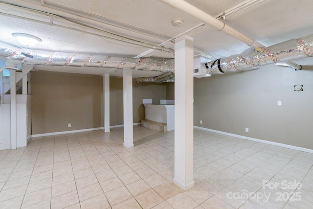 2519 Abelwood Rd, Charlotte, NC 28216 - finished basement featuring light tile patterned flooring and baseboards
