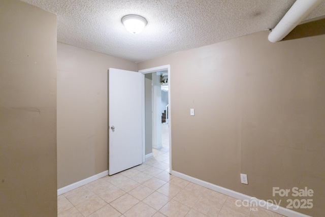2519 Abelwood Rd, Charlotte, NC 28216 - spare room with a textured ceiling and light tile patterned floors