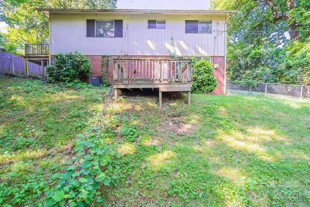 2519 Abelwood Rd, Charlotte, NC 28216 - rear view of property featuring brick siding and a wooden deck