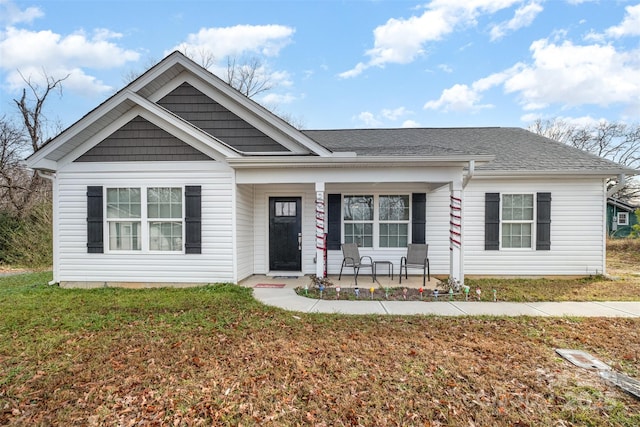 295 Colston St, Albemarle, NC 28001 - view of front of property with a porch, a front lawn, and roof with shingles