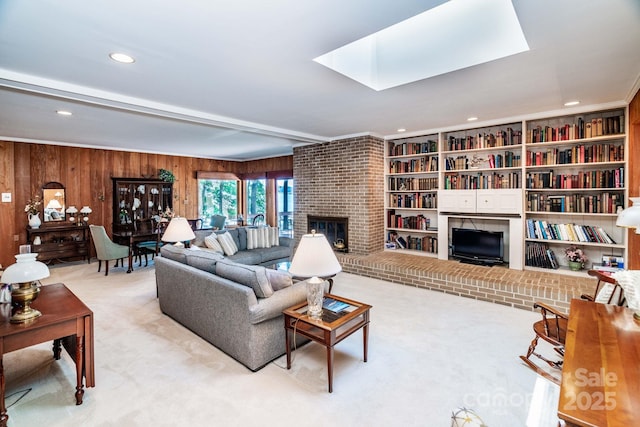 8448 Normandy Rd, Denver, NC 28037 - carpeted living area with wooden walls, a brick fireplace, and recessed lighting