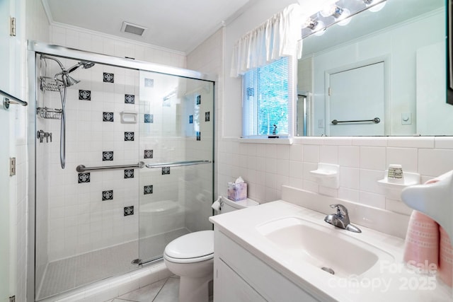 8448 Normandy Rd, Denver, NC 28037 - bathroom featuring ornamental molding, a stall shower, vanity, tile patterned flooring, and tile walls