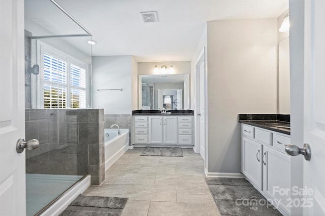 10906 Angler Ct, Davidson, NC 28036 - full bathroom featuring vanity, a bath, and a shower stall