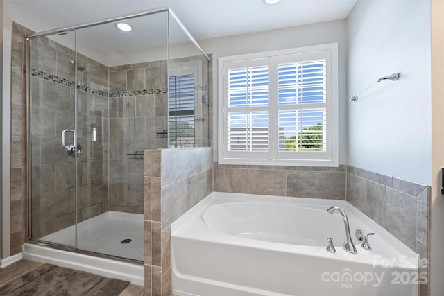 10906 Angler Ct, Davidson, NC 28036 - full bathroom featuring a garden tub, a stall shower, and recessed lighting