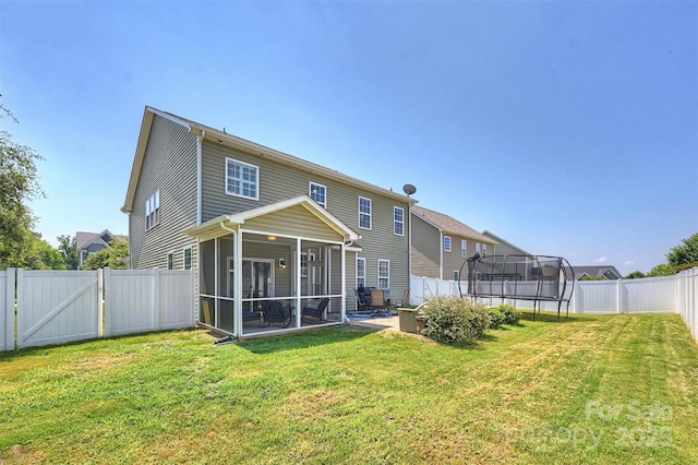 10906 Angler Ct, Davidson, NC 28036 - rear view of property featuring a trampoline, a gate, a sunroom, and a fenced backyard
