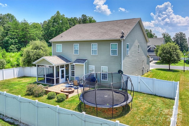 10906 Angler Ct, Davidson, NC 28036 - rear view of property featuring a gate, a fire pit, a shingled roof, and a sunroom